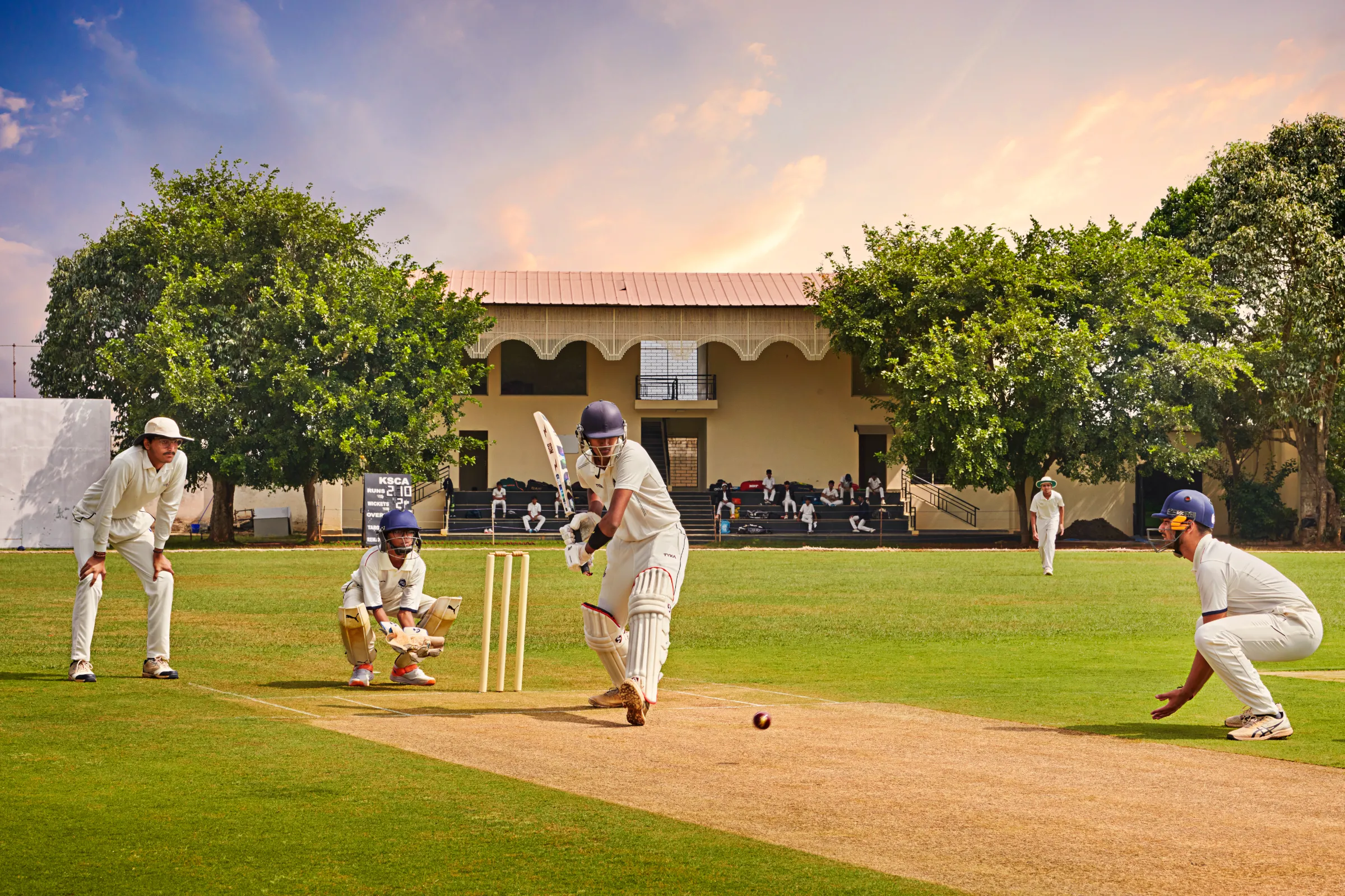 Batter playing a shot at the JAIN Sports cricket ground