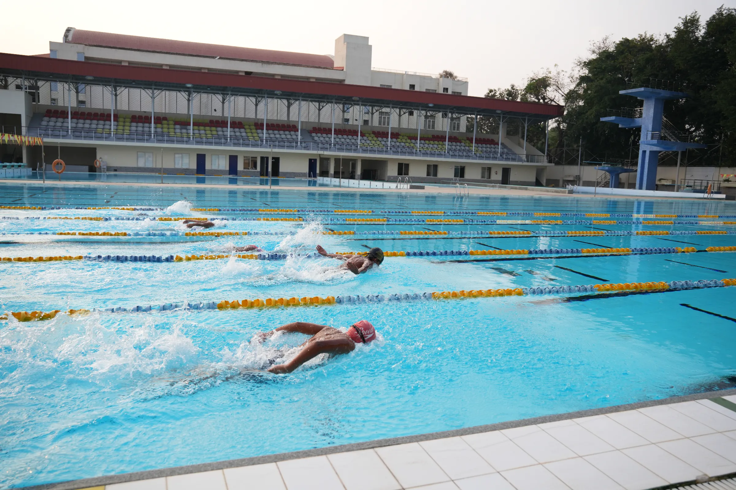 Swimmers training in the outdoor pool at JAIN Sports