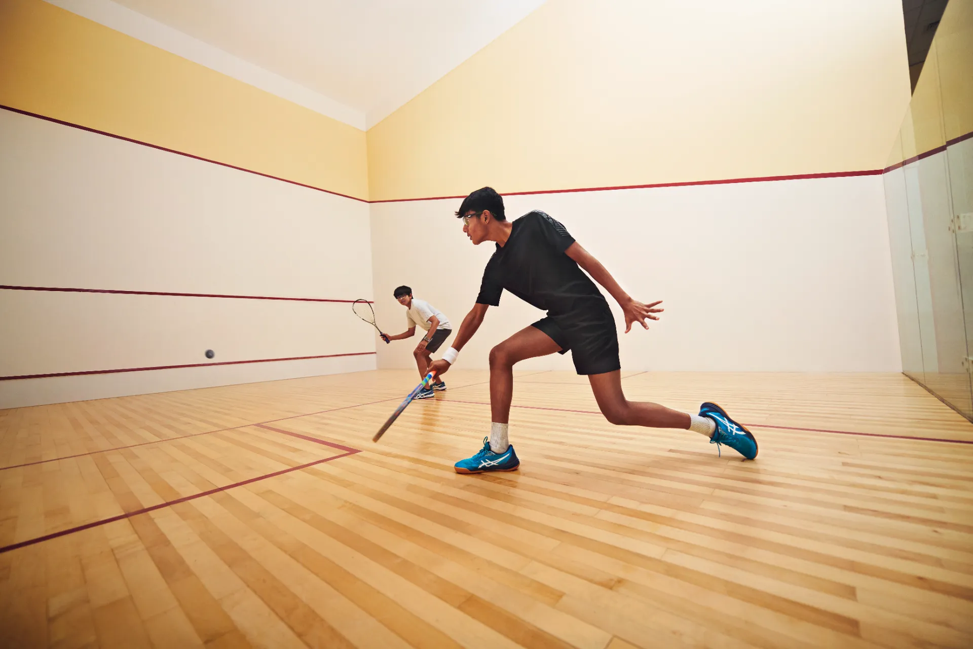 Squash players on court