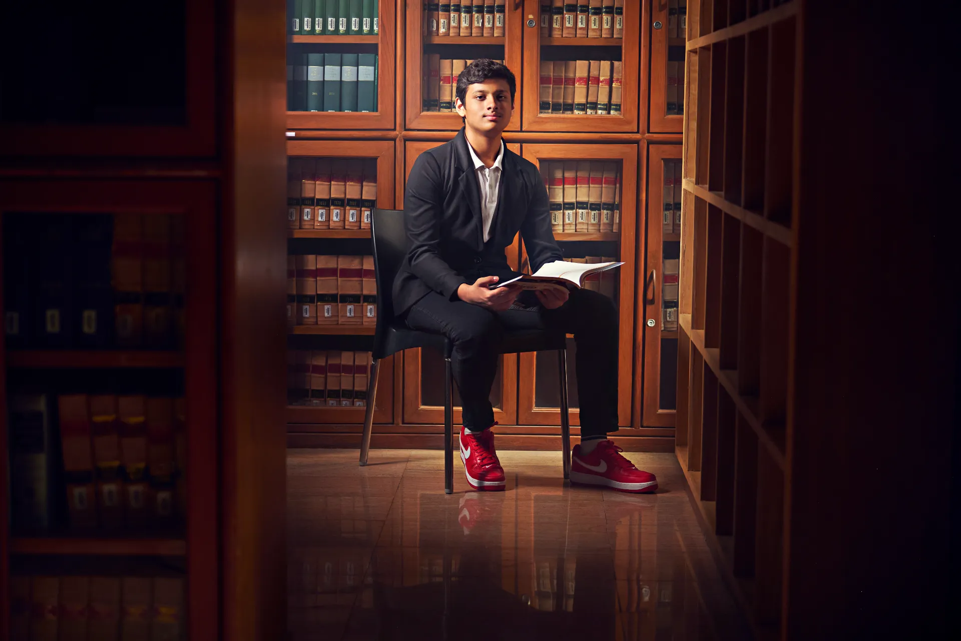 Student-athlete reading in the library